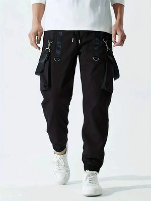 Techwear flap cargo pants, side view showing thigh flap pockets and ankle cut