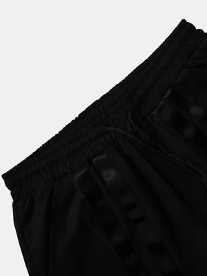 Techwear flap cargo pants, close-up on flap pocket and stitching detail