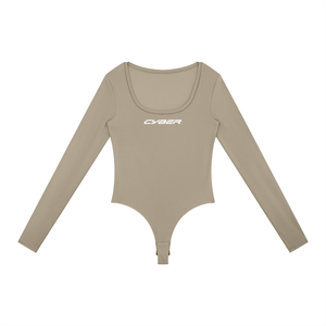 Khaki colourway of the long sleeve bodysuit laid flat, a light beige with the white CYBER wordmark