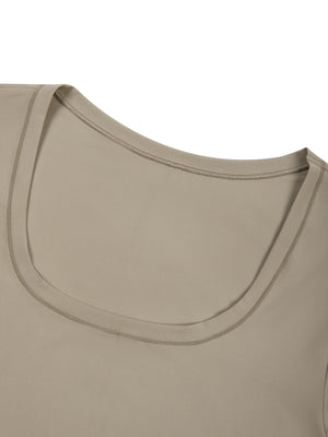 Close-up of the Khaki scoop neckline of the long sleeve bodysuit, a clean bound edge on the smooth knit