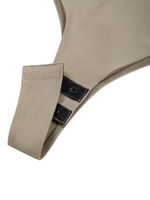 Close-up of the Khaki bodysuit gusset with its two snap closures, high-cut leg openings around it