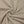 Khaki bodysuit fabric twisted into a spiral, close-up of the thin and smooth nylon and spandex knit
