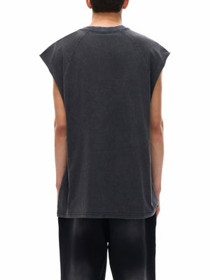 Man wearing the Tiger Tank Top Y2K, back view, showing the loose longline cut over black pants