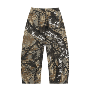 Back of the brown camo trousers, showing the wide leg tapering slightly towards a straight hem