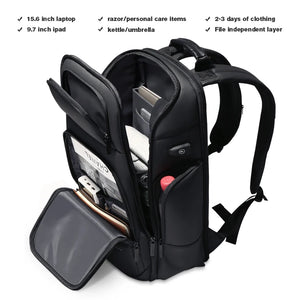 Black hardshell backpack with an external USB charging port and a 17 inch laptop sleeve
