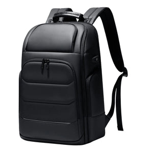 Black hardshell backpack with an external USB charging port and a 17 inch laptop sleeve