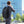 USB Port Techwear Backpack worn by a man in a suit with a charging cable, inset of the orange interior