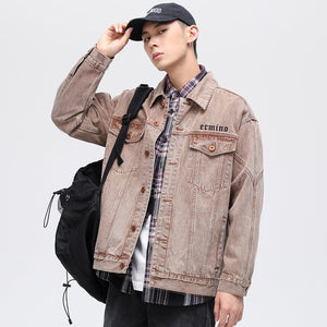 Vintage Brown Denim Y2K Jacket worn open with a cap and backpack, front view over a plaid flannel shirt