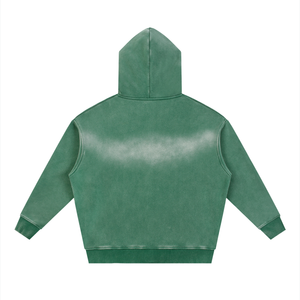 Back of the green hoodie laid flat, the sunfade concentrated across the upper back