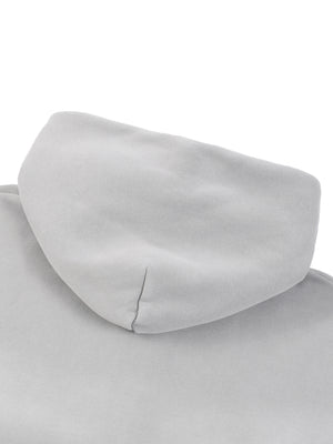 The hood photographed flat, double-layered and seamed down the centre back of the hood