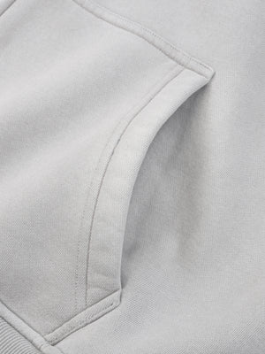 Close-up of a slash pocket opening, set at an angle into the side seam of the body