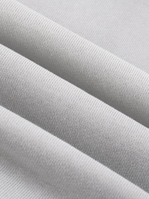 Layers of the fleece stacked to show the loop-back face and the weight of the knit