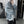 Light blue washed jean jacket in a mirror selfie, side view showing the dropped shoulder and sleeve