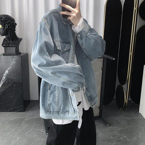 Light blue washed jean jacket in a mirror selfie, side view showing the dropped shoulder and sleeve