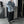 Full length view of the light blue denim jacket with wide black trousers and sneakers in a studio