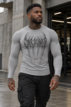 Flecking gray colourway on a man walking outside a gym, the black root lettering across the chest
