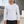 Man in the White Workout Long Sleeve Compression Shirt outdoors, front view with the small black CYBER logo