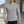 Man walking in the Flecking Gray long sleeve compression shirt, front view of the raglan sleeves and crew neck