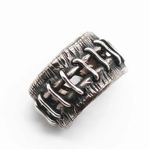 Wound Stitches Gothic Ring, top view of the stitched opening running along the textured band