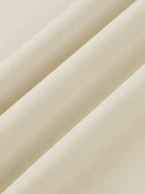 The same cotton fabric draped in folds, showing how the midweight knit falls without clinging