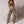 Zip Denim Y2K Overalls in camo print, front view of the high waist and wide leg with an olive top