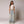 Zip Denim Y2K Overalls in light blue wash, studio front view over a white tee with trainers