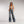 Zip Denim Y2K Overalls in mid blue, front view with the full-length front zip and a cream bralette