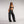 Zip Denim Y2K Overalls in washed black, three-quarter front view with the zip and side loop