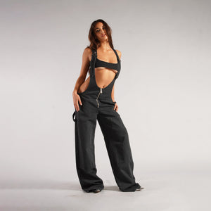 Zip Denim Y2K Overalls in washed black, three-quarter front view with the zip and side loop