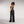 Zip Denim Y2K Overalls in washed black, three-quarter back view of the straps and wide leg