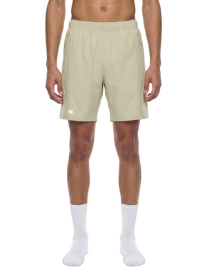 Model wearing the Bean Green zip pocket basketball shorts, front view with elastic waist and logo