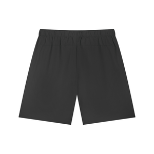 Back of the Black zip pocket basketball shorts laid flat, wide elastic waistband and straight hems