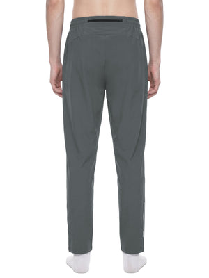 Back view of the Gray zip pocket joggers on a model, horizontal zip pocket and elastic waistband