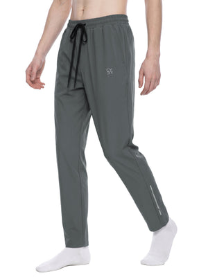 Gray joggers in a walking three-quarter view on a model, long black drawstring and tapered leg