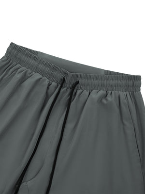 Close-up of the Gray joggers waistband, elastic band with black drawstring and side pocket opening