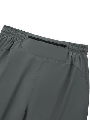 Detail of the back zip pocket on the Gray gym joggers, black zipper set below the elastic waistband