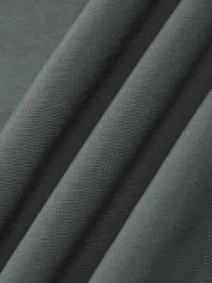 Close-up of the Gray polyester and spandex fabric of the zip pocket gym joggers, fine knit texture