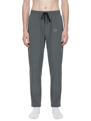 Gray gym joggers worn front view on a white background, black drawstring and tapered ankle length legs