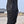 Close-up of the black Zip Pocket Tactical Cyberpunk Pants, zipped slanted hip pocket and thigh cargo flap
