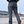Back view of the gray tactical cargo pants, hands on the hips, back pockets and straight leg down to the shoes