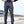 Gray cyberpunk pants front view, man with hands on hips, black belt, flap cargo pockets on both thighs