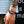 Zodiac Glow Y2K Bracelet worn on a tattooed wrist, braided black band with a blue zodiac cabochon