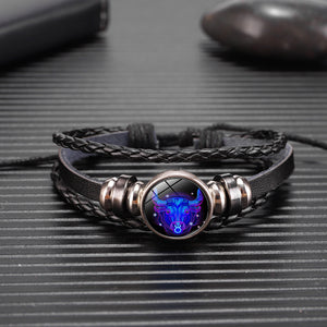 Zodiac Glow Y2K Bracelet close-up on a ribbed surface with the Taurus bull cabochon and bronze beads