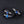 Three Zodiac Glow Y2K Bracelets on a black background, blue constellation cabochons on braided bands