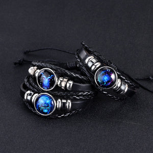 Three Zodiac Glow Y2K Bracelets on a black background, blue constellation cabochons on braided bands